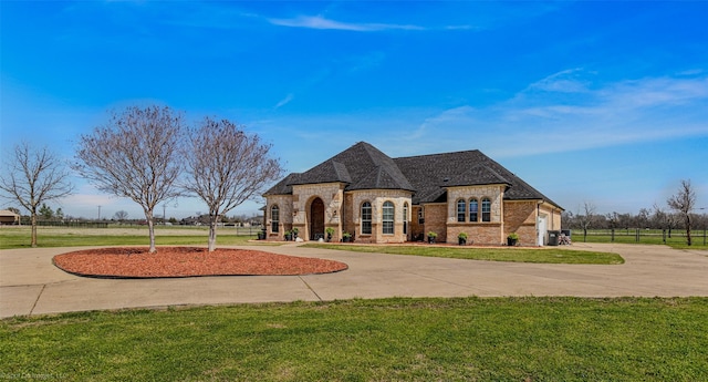 477 Horseshoe Bnd, Royse City, TX 75189 - french country style house with curved driveway, brick siding, and roof with shingles