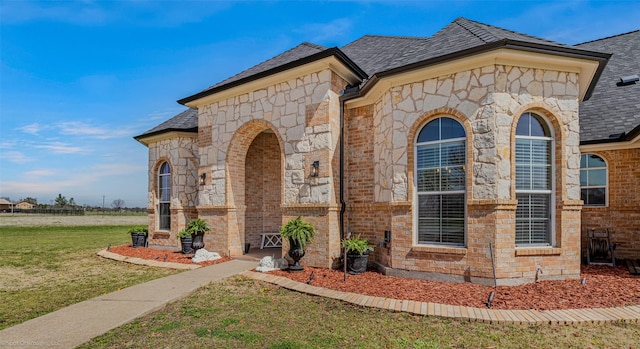 477 Horseshoe Bnd, Royse City, TX 75189 - view of front of house featuring stone siding, a front yard, brick siding, and a shingled roof