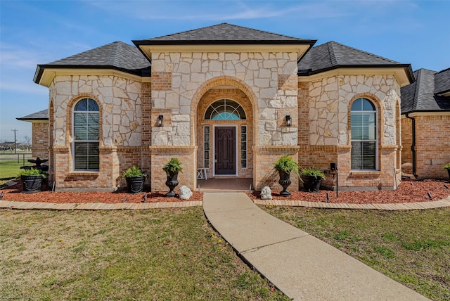 477 Horseshoe Bnd, Royse City, TX 75189 - french country home with stone siding, a front yard, and brick siding