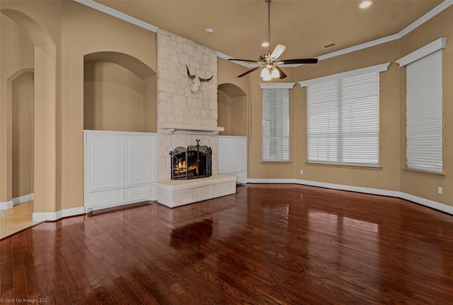 477 Horseshoe Bnd, Royse City, TX 75189 - unfurnished living room featuring wood finished floors, a ceiling fan, a stone fireplace, ornamental molding, and recessed lighting