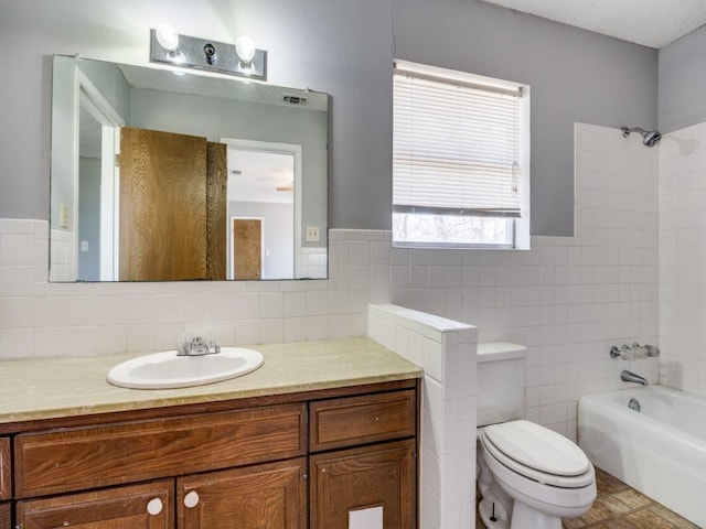 1805 Jamaica Ln, Sherman, TX 75092 - bathroom featuring wainscoting, vanity, toilet, shower / bath combination, and tile walls