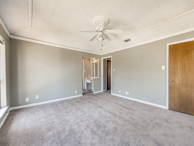 1805 Jamaica Ln, Sherman, TX 75092 - carpeted spare room with a tray ceiling, a ceiling fan, a textured ceiling, and visible vents