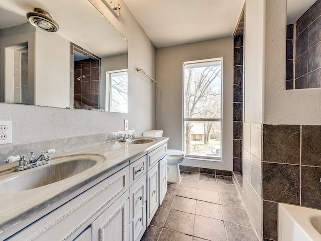 1805 Jamaica Ln, Sherman, TX 75092 - full bathroom with double vanity, a sink, a tub, and toilet