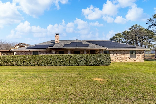 101 Hill Top Cir, Burleson, TX 76028 - rear view of house featuring a lawn, roof mounted solar panels, and a chimney