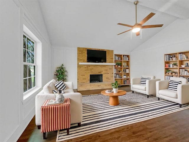 925 Old Mill Cir, Irving, TX 75061 - living area with beam ceiling, wood finished floors, ceiling fan, and a fireplace