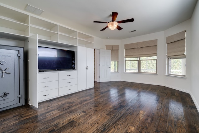 unfurnished living room featuring visible vents, baseboards, a ceiling fan, and dark wood-style floors