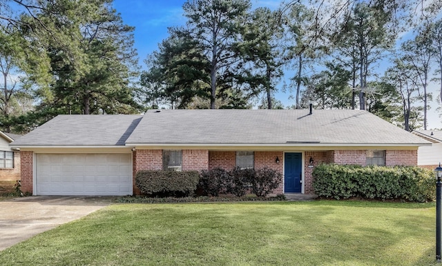 ranch-style house with a garage, concrete driveway, a front lawn, and brick siding