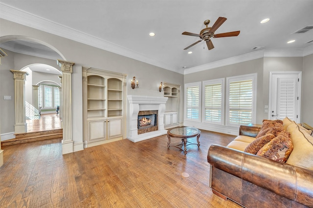 2909 Canyon Creek Dr, Sherman, TX 75092 - living area featuring decorative columns, arched walkways, a ceiling fan, wood finished floors, and recessed lighting