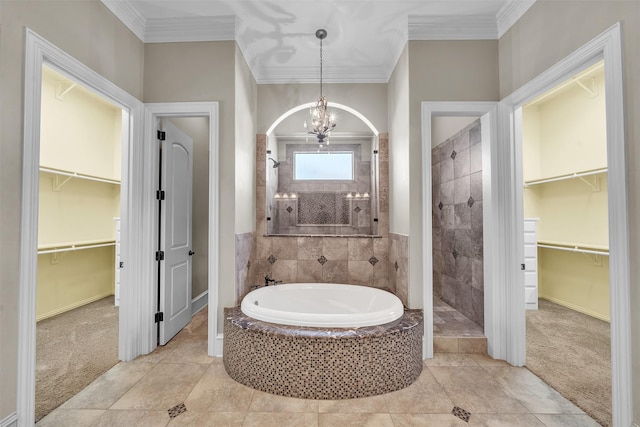 2909 Canyon Creek Dr, Sherman, TX 75092 - bathroom featuring a garden tub, ornamental molding, a spacious closet, tiled shower, and a chandelier