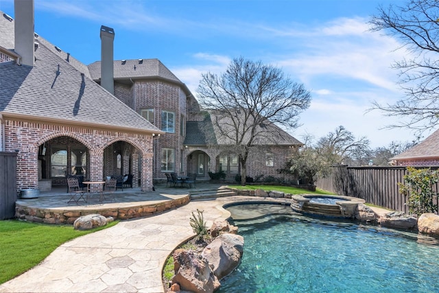 2909 Canyon Creek Dr, Sherman, TX 75092 - view of swimming pool with a patio area and a pool with connected hot tub