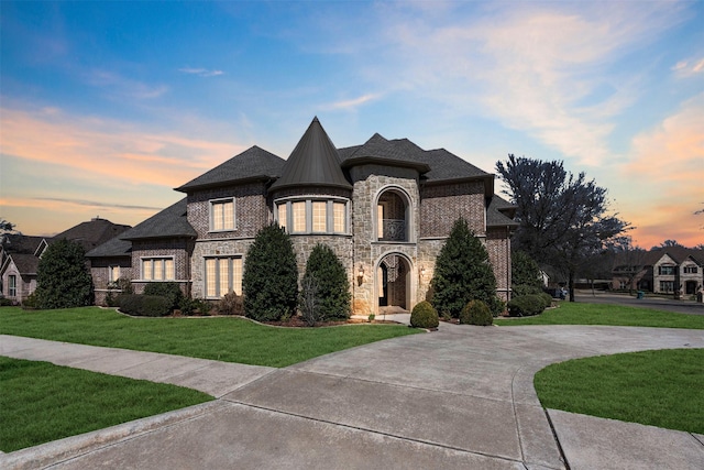 2909 Canyon Creek Dr, Sherman, TX 75092 - french country style house featuring a front lawn, stone siding, and brick siding