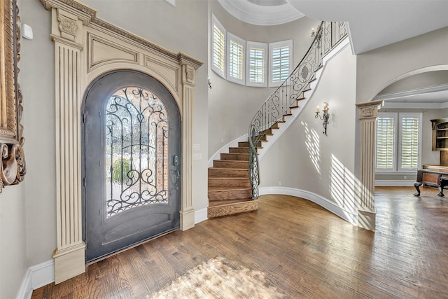 2909 Canyon Creek Dr, Sherman, TX 75092 - foyer with a towering ceiling, arched walkways, stairway, and wood finished floors