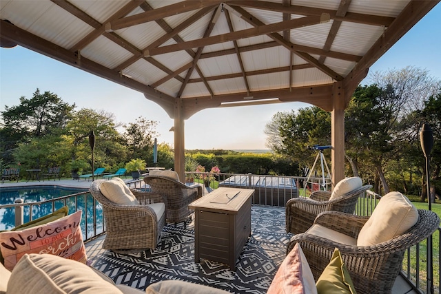 view of patio / terrace with an outdoor living space, a gazebo, and an outdoor pool