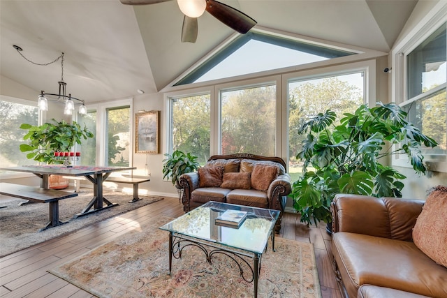 sunroom / solarium with wood-type flooring and lofted ceiling