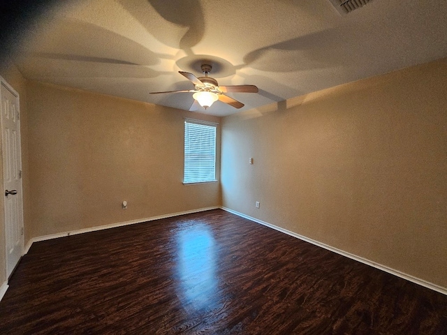 1416 Connie St, Burleson, TX 76028 - unfurnished room featuring a ceiling fan, a textured ceiling, baseboards, dark wood-style flooring, and visible vents