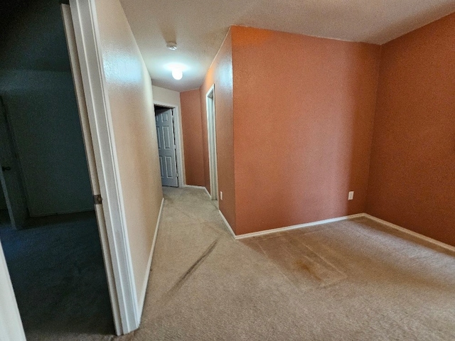 1416 Connie St, Burleson, TX 76028 - hallway with baseboards and carpet flooring