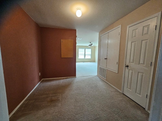 1416 Connie St, Burleson, TX 76028 - hall with baseboards, a textured ceiling, visible vents, and carpet