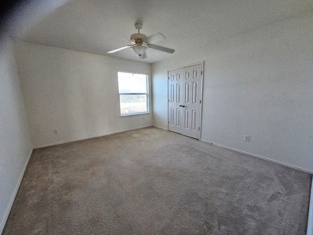 1416 Connie St, Burleson, TX 76028 - unfurnished bedroom featuring carpet flooring, baseboards, a closet, and a ceiling fan