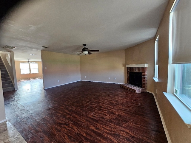 1416 Connie St, Burleson, TX 76028 - unfurnished living room with wood finished floors, stairway, a fireplace, and ceiling fan