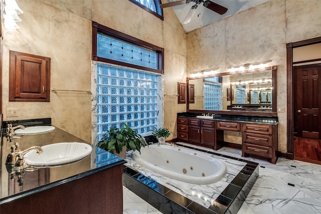 bathroom featuring double vanity, ceiling fan, a sink, and marble finish floor