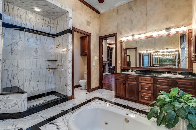 bathroom with baseboards, a sink, marble finish floor, and a shower stall