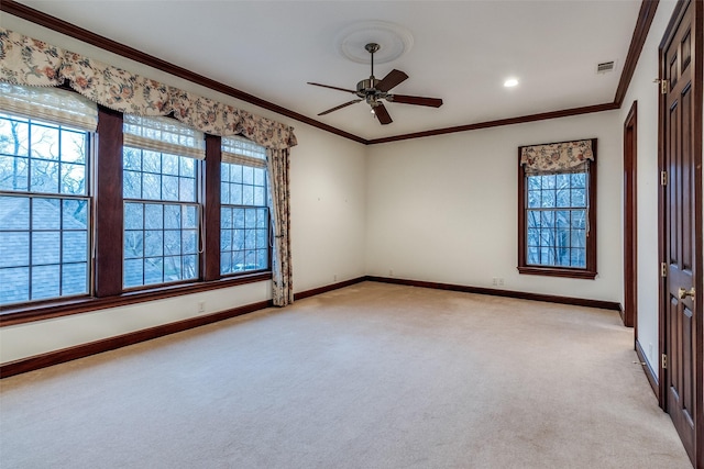 unfurnished room featuring visible vents, baseboards, plenty of natural light, and light carpet