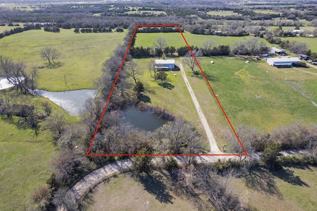birds eye view of property with a rural view and a water view