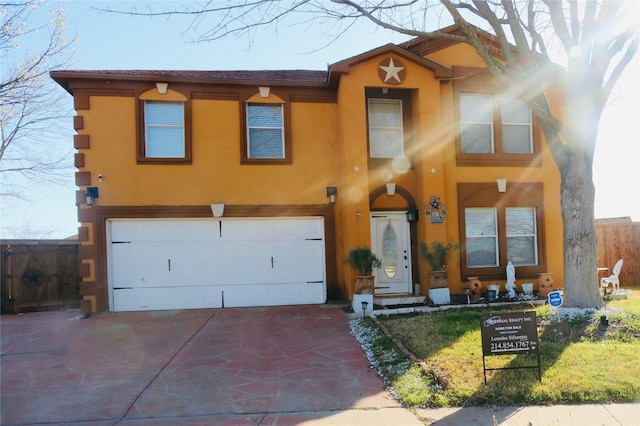 1124 Mazourka Dr, Arlington, TX 76001 - view of front of property with stucco siding, an attached garage, and driveway