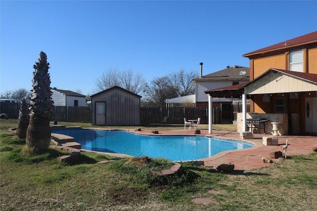 1124 Mazourka Dr, Arlington, TX 76001 - view of swimming pool featuring a patio, an outbuilding, a fenced backyard, a storage unit, and outdoor dry bar
