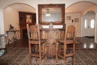 1124 Mazourka Dr, Arlington, TX 76001 - bar featuring arched walkways, a ceiling fan, and wood finished floors