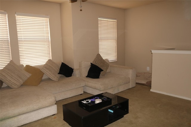 1124 Mazourka Dr, Arlington, TX 76001 - living room featuring a ceiling fan, baseboards, and carpet floors