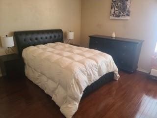 1124 Mazourka Dr, Arlington, TX 76001 - bedroom featuring wood finished floors and baseboards