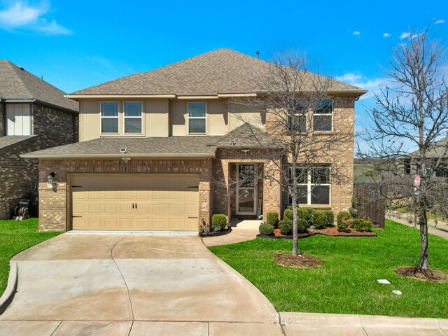 view of front of house featuring an attached garage, brick siding, a front lawn, driveway, and a shingled roof