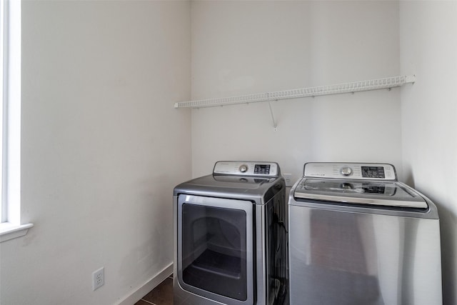 3800 Holland Ave Unit 1, Dallas, TX 75219 - laundry area with dark tile patterned flooring, laundry area, and washing machine and dryer