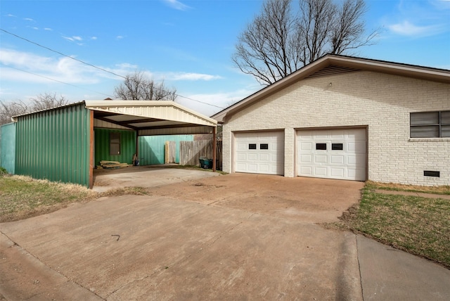 411 N 5th Ave, Munday, TX 76371 - view of side of property with brick siding, concrete driveway, and fence