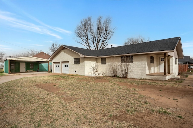 411 N 5th Ave, Munday, TX 76371 - view of front of property featuring brick siding, an attached garage, concrete driveway, and a shingled roof