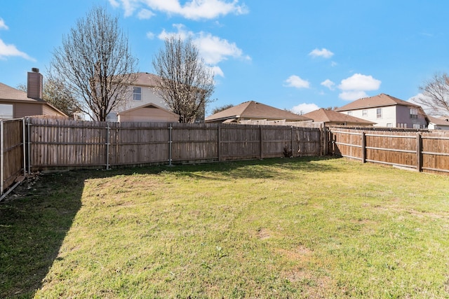 view of yard featuring a fenced backyard