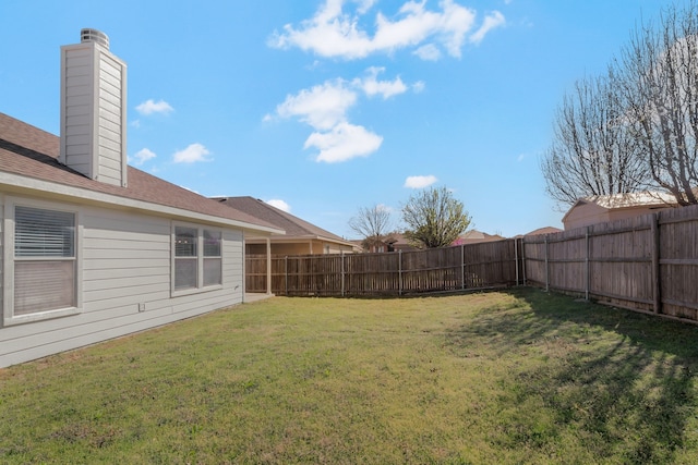 view of yard featuring a fenced backyard