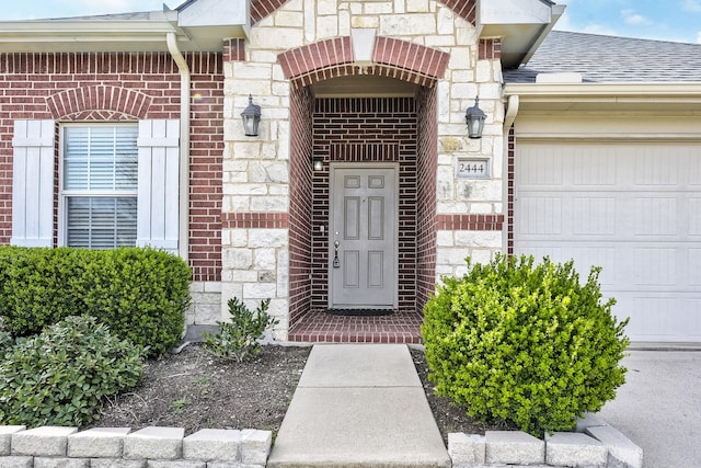 2444 Horseback Trl, Fort Worth, TX 76177 - property entrance with a garage, stone siding, brick siding, and a shingled roof