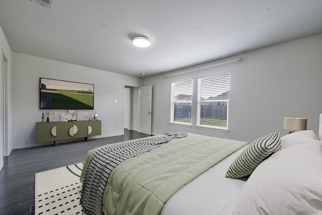2444 Horseback Trl, Fort Worth, TX 76177 - bedroom featuring wood finished floors, baseboards, and a textured ceiling
