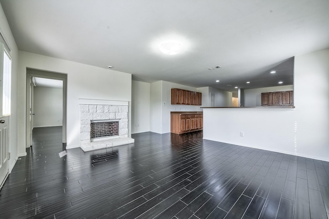 2444 Horseback Trl, Fort Worth, TX 76177 - unfurnished living room featuring baseboards, dark wood finished floors, recessed lighting, and a fireplace