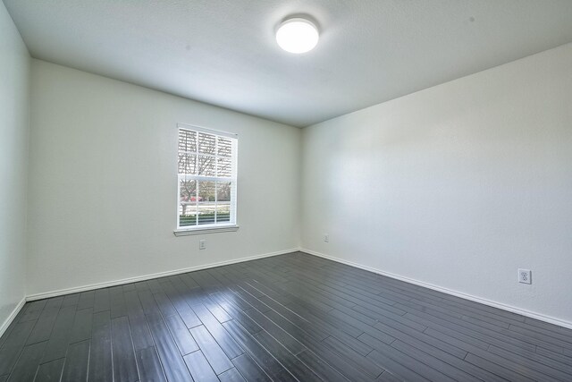2444 Horseback Trl, Fort Worth, TX 76177 - empty room with dark wood-style floors and baseboards