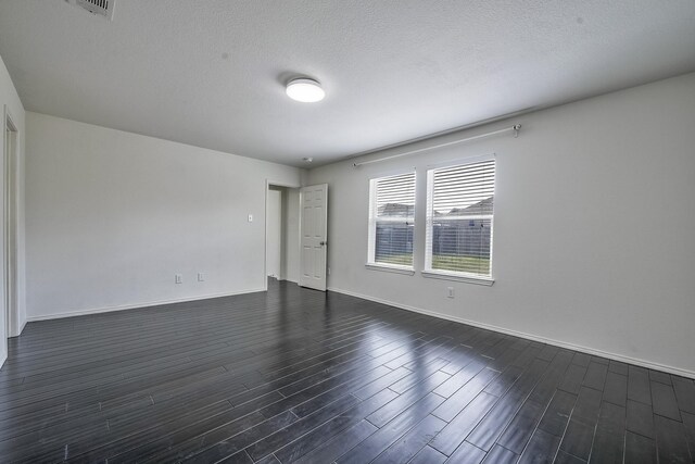 2444 Horseback Trl, Fort Worth, TX 76177 - spare room with dark wood-style floors, baseboards, and a textured ceiling