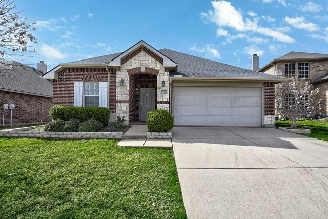 2444 Horseback Trl, Fort Worth, TX 76177 - view of front of home featuring brick siding, an attached garage, driveway, and a front yard