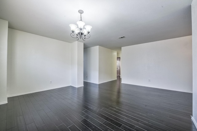 2444 Horseback Trl, Fort Worth, TX 76177 - spare room featuring a chandelier, dark wood finished floors, and baseboards