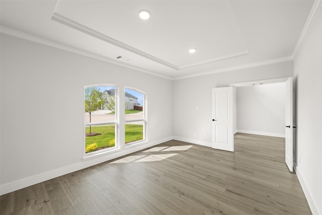 7127 Seagrove Ct, Grand Prairie, TX 75054 - unfurnished room with a tray ceiling, wood finished floors, ornamental molding, and recessed lighting
