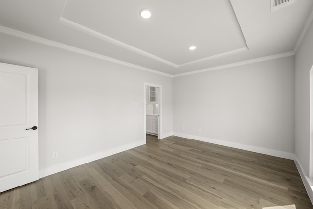 7127 Seagrove Ct, Grand Prairie, TX 75054 - spare room with a raised ceiling, wood finished floors, recessed lighting, and crown molding