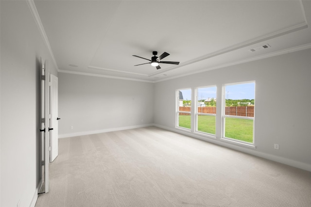 7127 Seagrove Ct, Grand Prairie, TX 75054 - empty room featuring light carpet, ornamental molding, a ceiling fan, and a tray ceiling