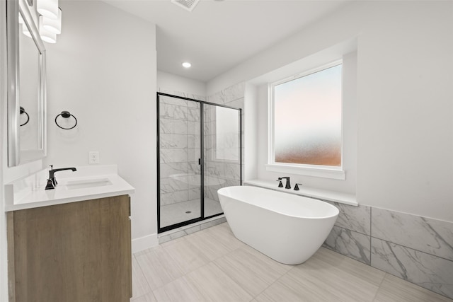 7127 Seagrove Ct, Grand Prairie, TX 75054 - bathroom featuring a freestanding bath, a shower stall, and double vanity