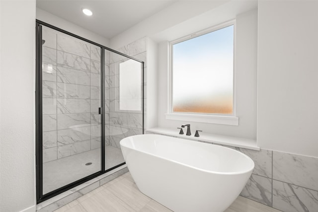 7127 Seagrove Ct, Grand Prairie, TX 75054 - bathroom with a soaking tub, a shower stall, and plenty of natural light